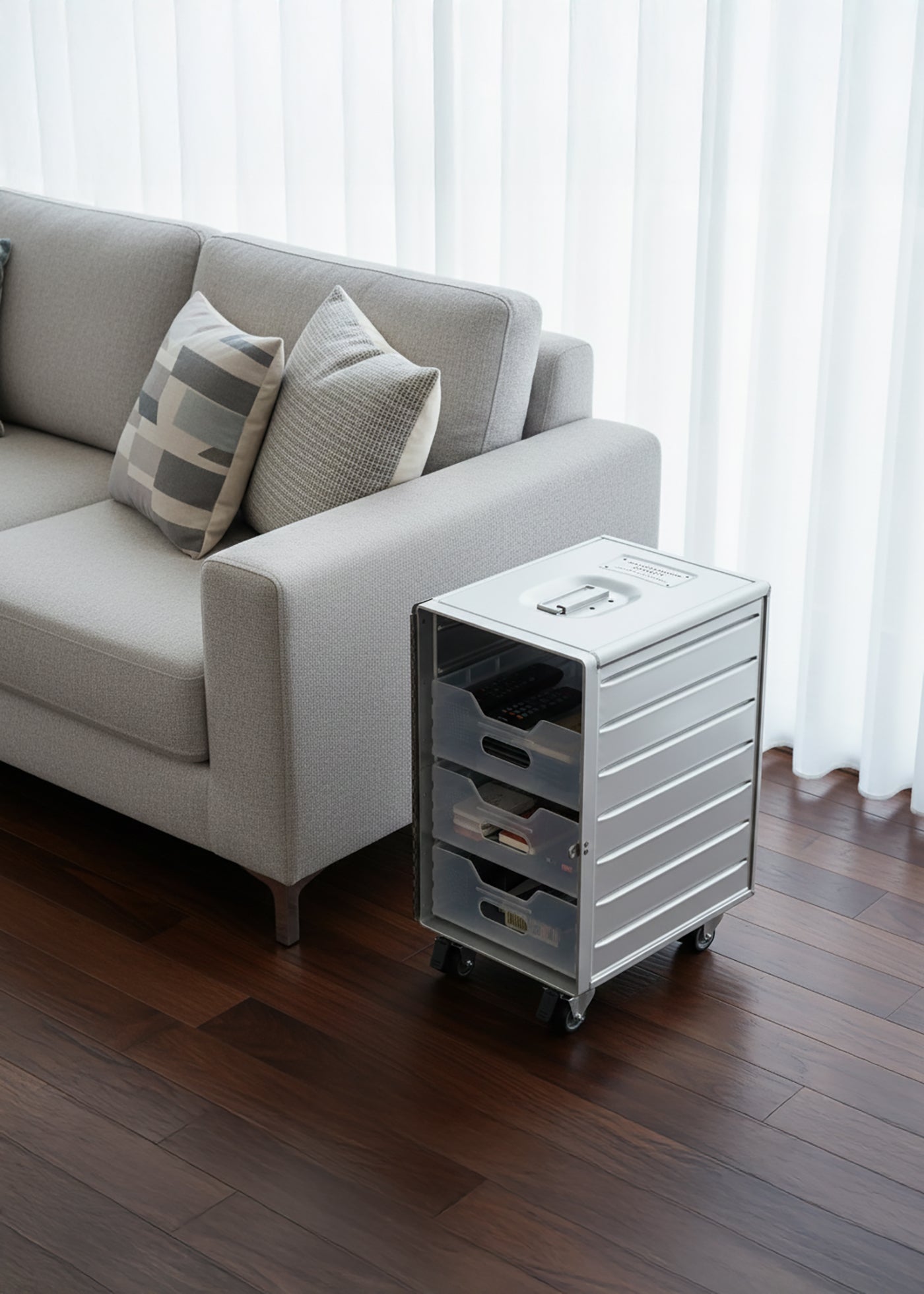 Hangar74 Airline box in silver with three drawers, shown in living room as rolling storage unit
